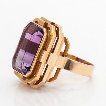 A 14K gold ring with amethyst.