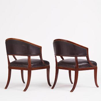 A near pair of mahogany open armchairs, one late Gustavian, Stockholm circa 1800.