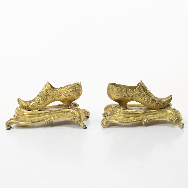 Table ornaments in the form of shoes, a pair, fire-gilt bronze, probably France, 19th century.