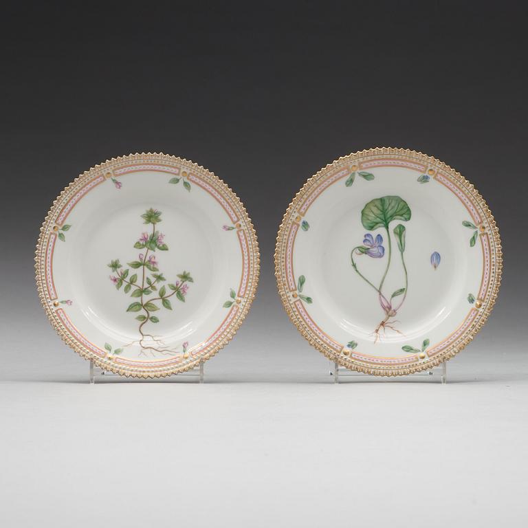 A set of eight cups with stands and six dessert dishes, Royal Copenhagen, 'Flora Danica', 20th Century.