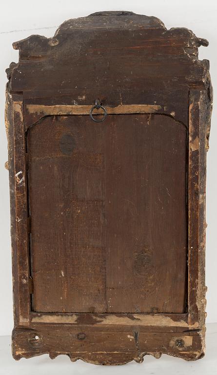 A second half of the 18th century rococo mirror sconce.