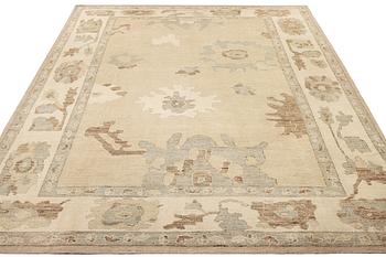 An Ushak design carpet, a. 426 x 307 cm.