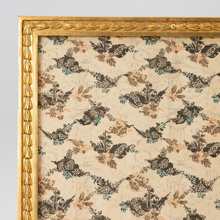 A Louis XVI style folding screen, circa 1900, with fabric from the 18th century.