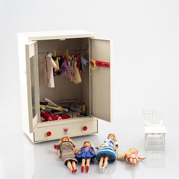 A toy wardrobe from Micki Leksaker, Gemla, Sweden and four Barbie dolls, Mattel.