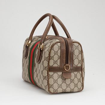 GUCCI, a monogram canvas handbag.