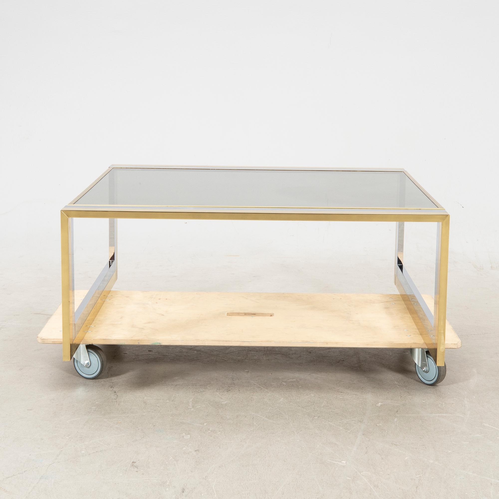 A glass and metal coffee table from Romeo Rega second half of the 20th century.