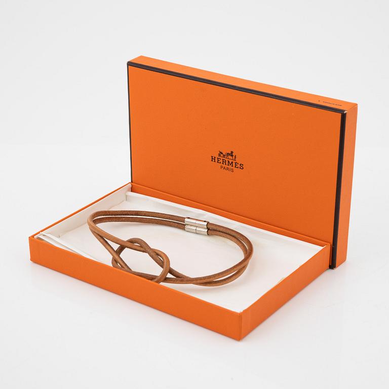 Hermès, a 'Atamé' leather knot necklace.