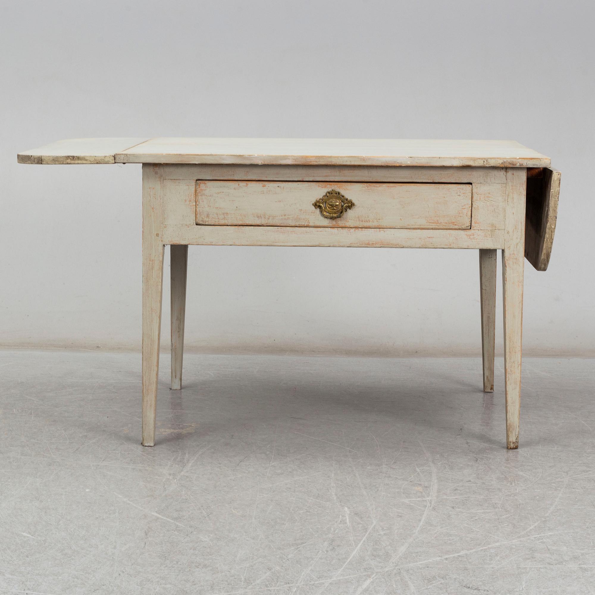 An early 19t Century folding table.