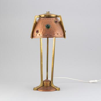 An early 20th century, brass and copper table lamp.