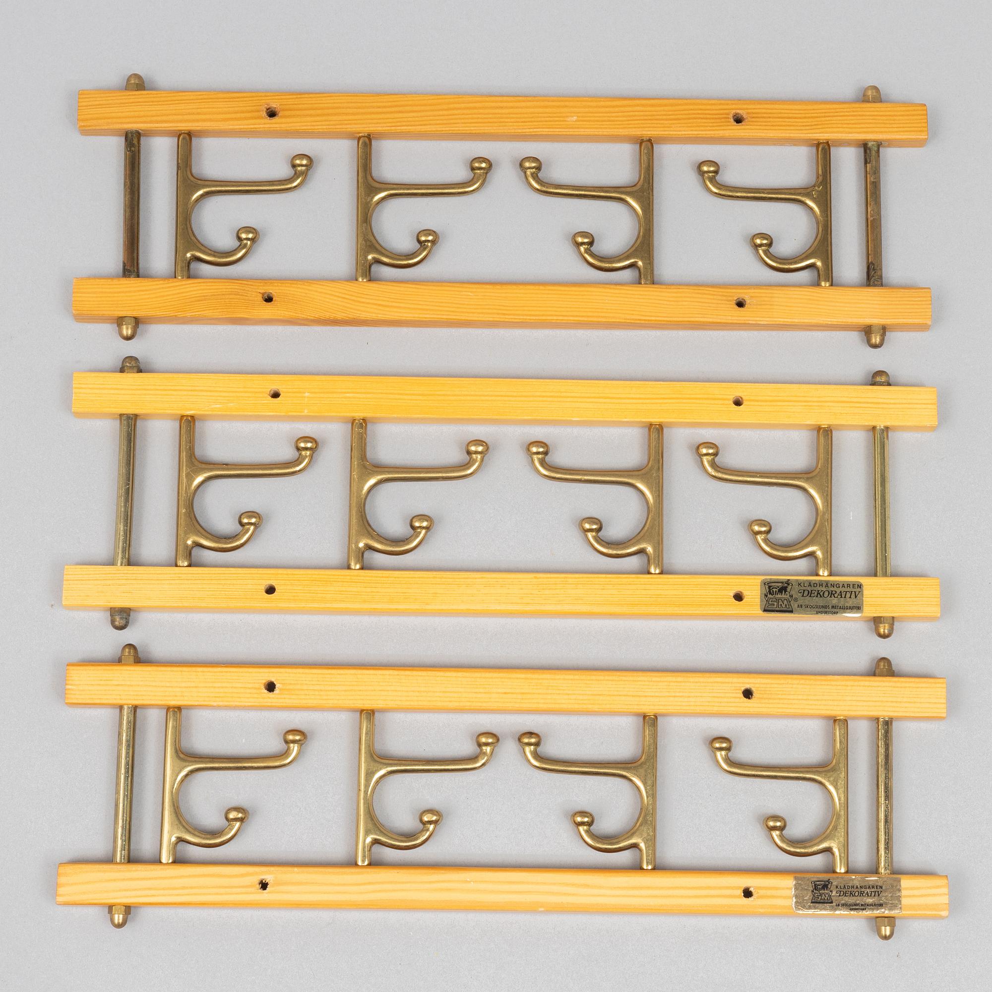 A set of three 'Dekorativ' coat hangers, Skoglunds metallgjuteri, Anderstorp, 1950s/60s.