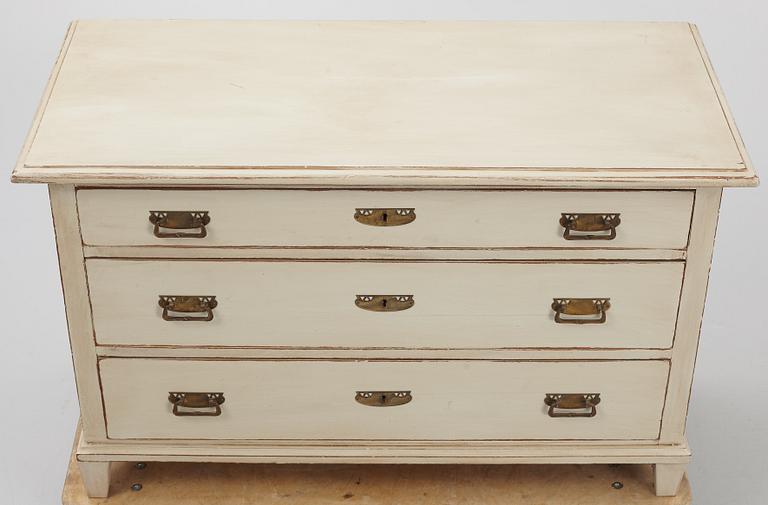 A chest of drawers, circa 1900.