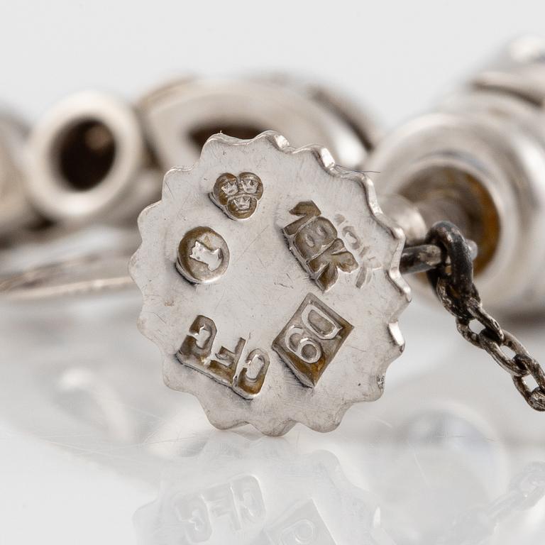 A pair of earrings with sapphires and diamonds, stamped Carlman.