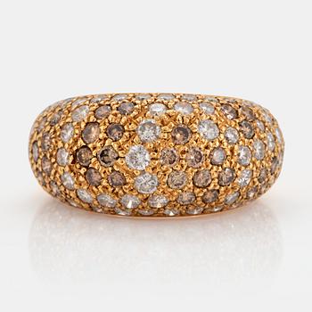 1027. A Cartier "Sauvage" ring in 18K gold set with white and brown round brilliant-cut diamonds.