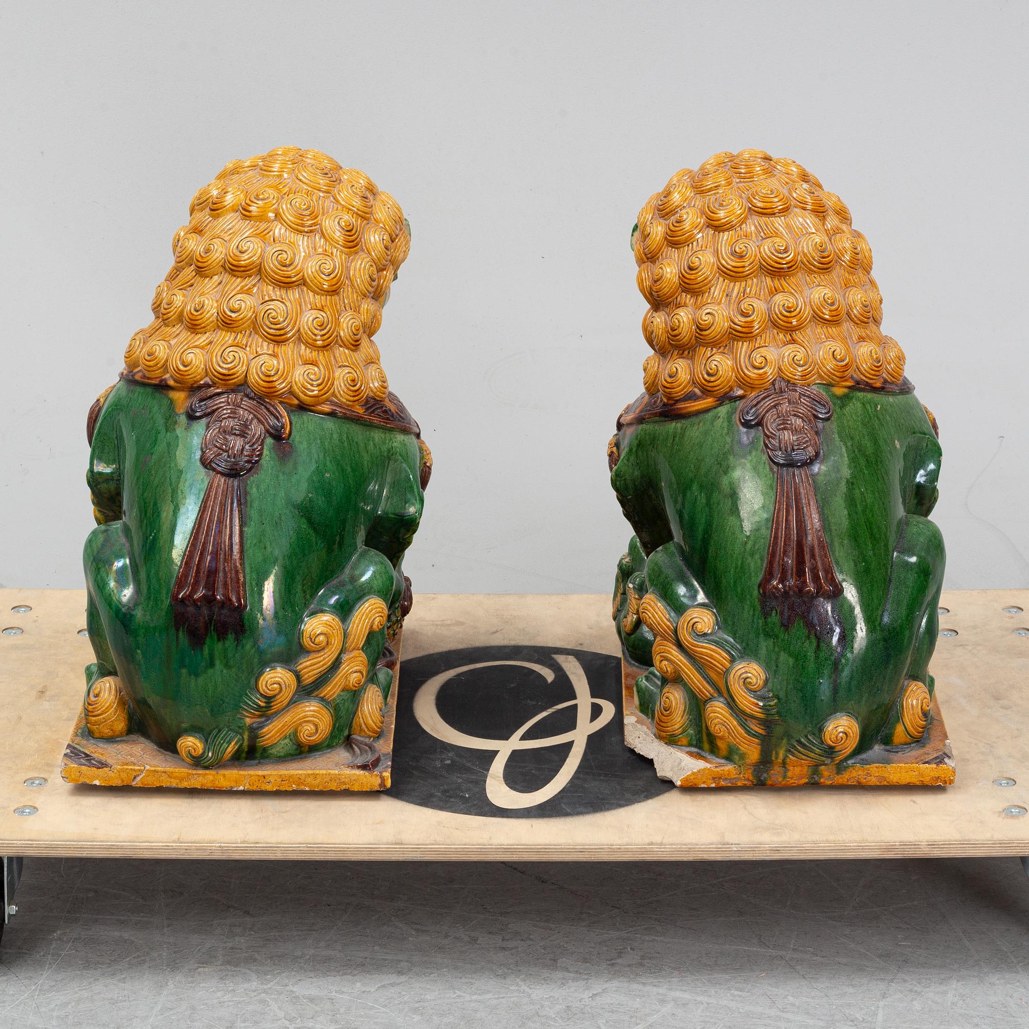 A pair of sancai-glazed chinese buddhist lions or guardian lions, early 20th century.