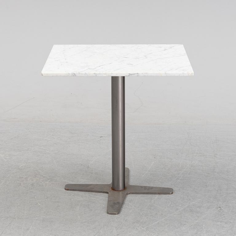 A marble top table, 21th century.