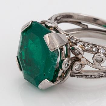 An octagonal cut 6.50 ct emerald and brilliant cut diamond ring. Mandelstam 'Ice Age'.
