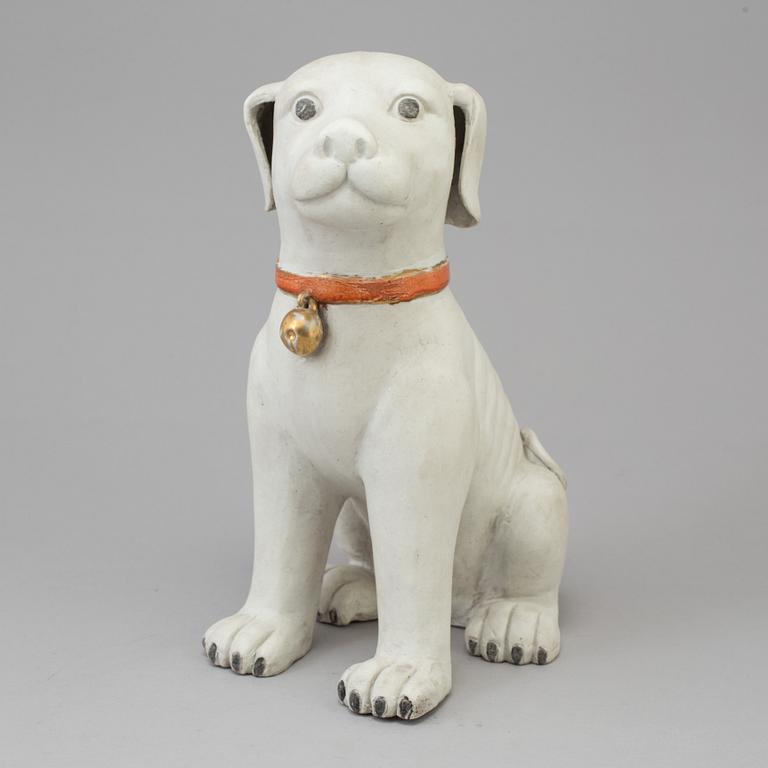 A chinese porcelain figure of a dog, after a 18th century model. China, 20th Century.