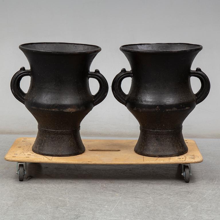 A pair of cast iron garden vases, 20th Century.