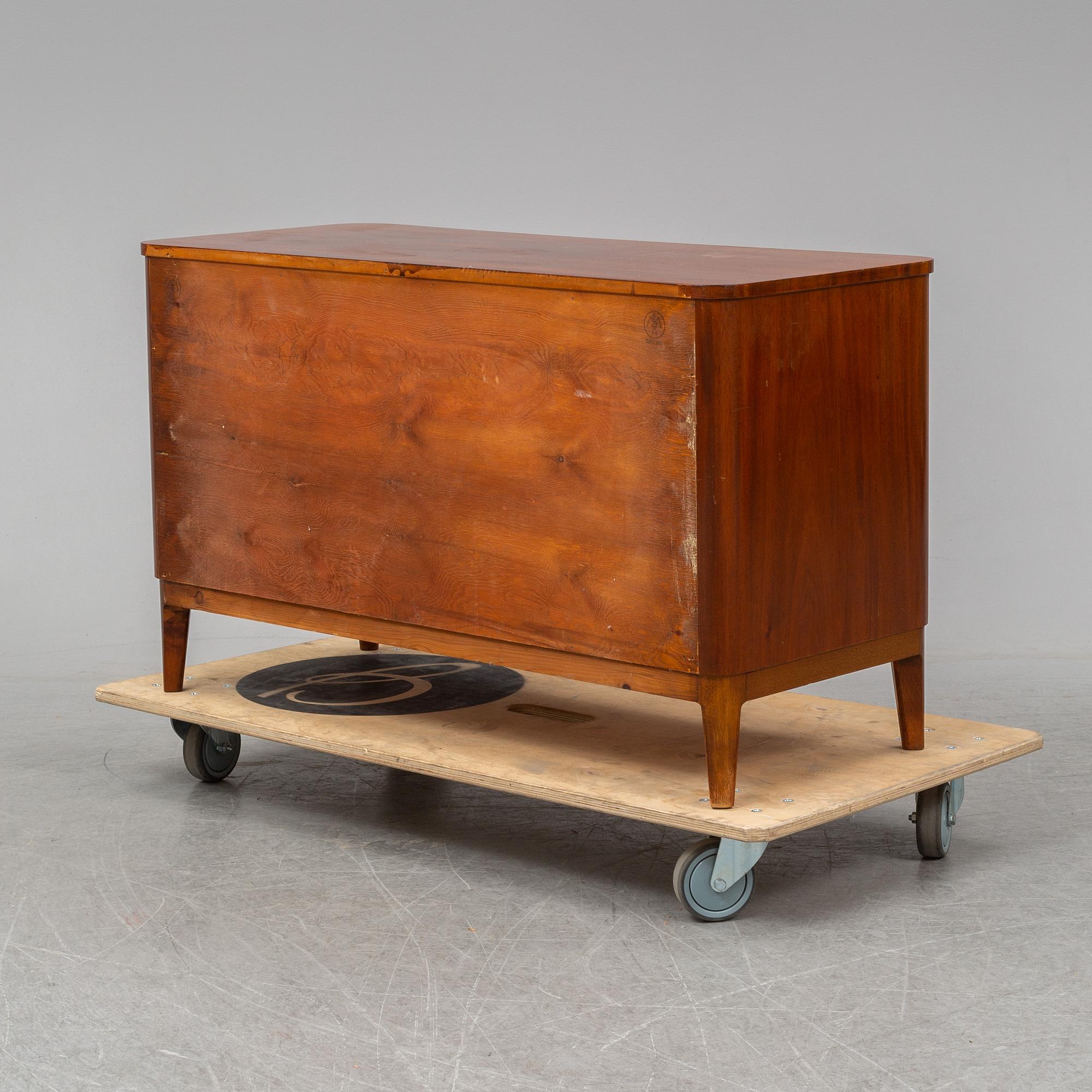 A 1940s Swedish Modern mahogany veneered chest of three drawers.