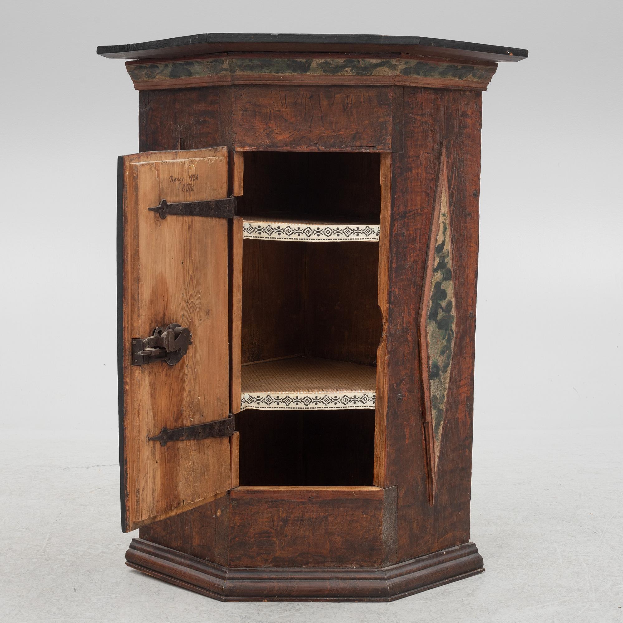 A corner cabinet, 18th Century.