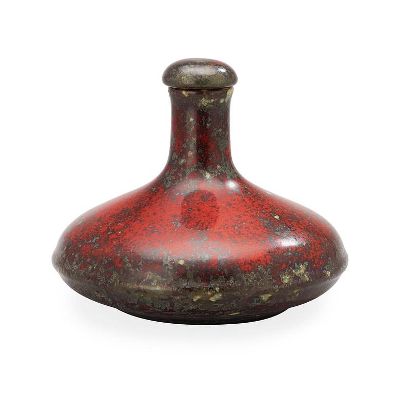 A Hans Hedberg faience bottle with stopper.