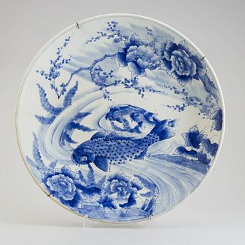 A massive blue and white Japanese dish, 20th century.