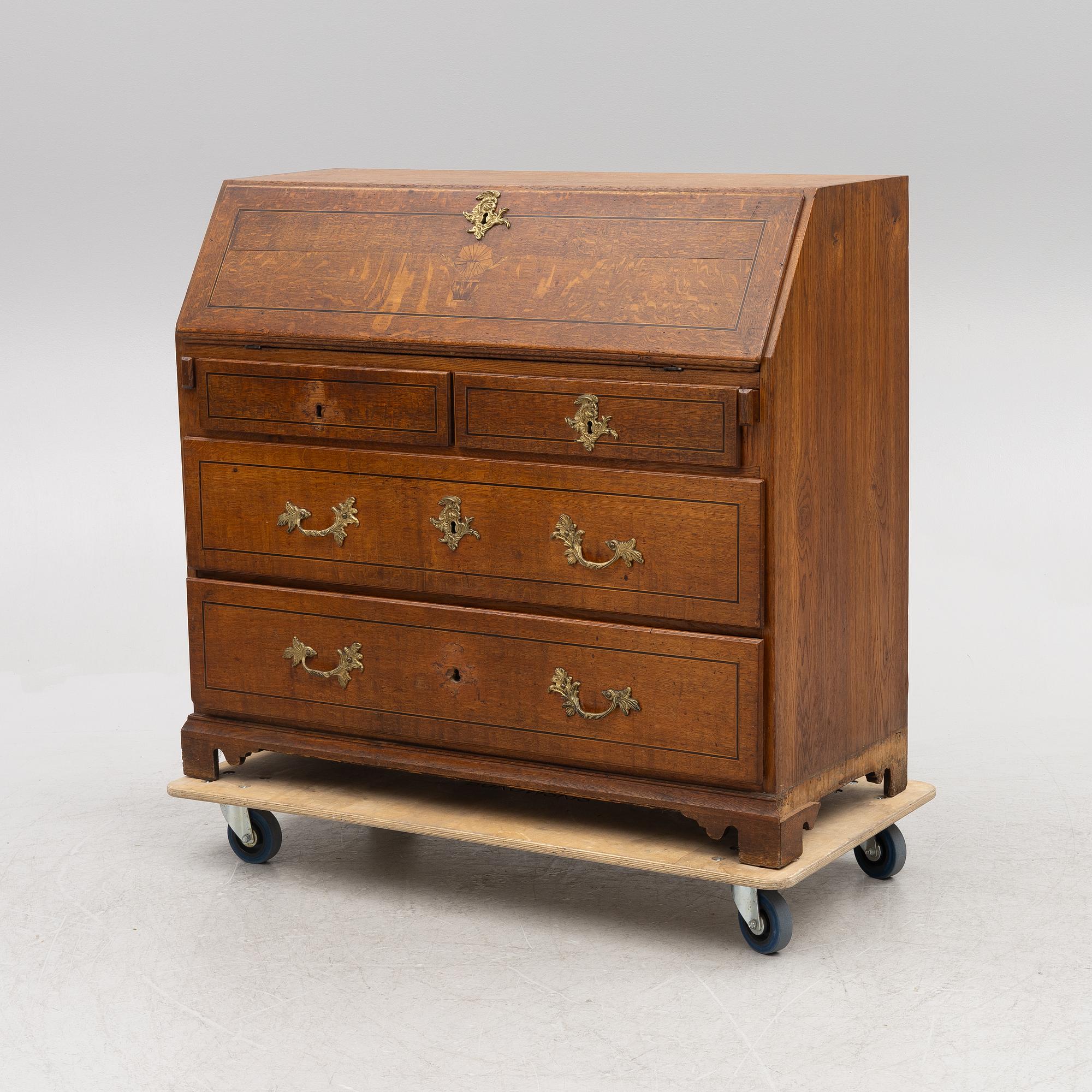 An oak secretaire, first half of the 19th century.
