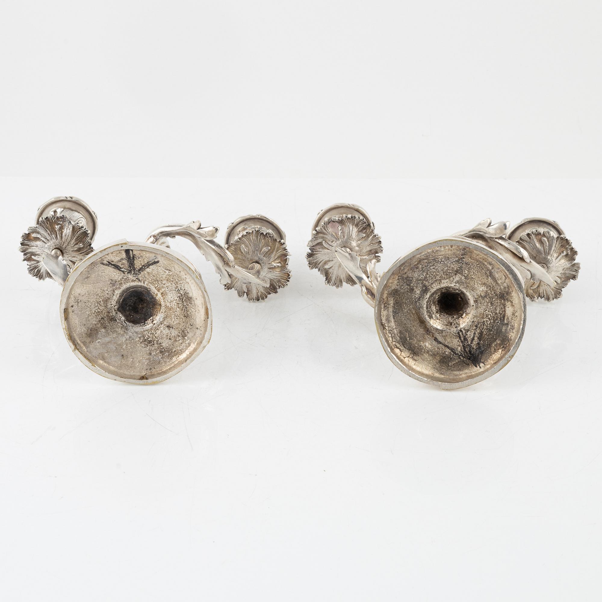 A rococo style pair of silverplated candelabras, end of the 19th Century..