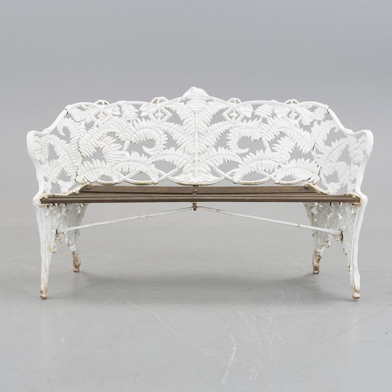 A WHITEPAINTED EARLY 20TH CENTURY SWEDISH AGGENBERG CAST IRON AND WOOD GARDEN SOFA.