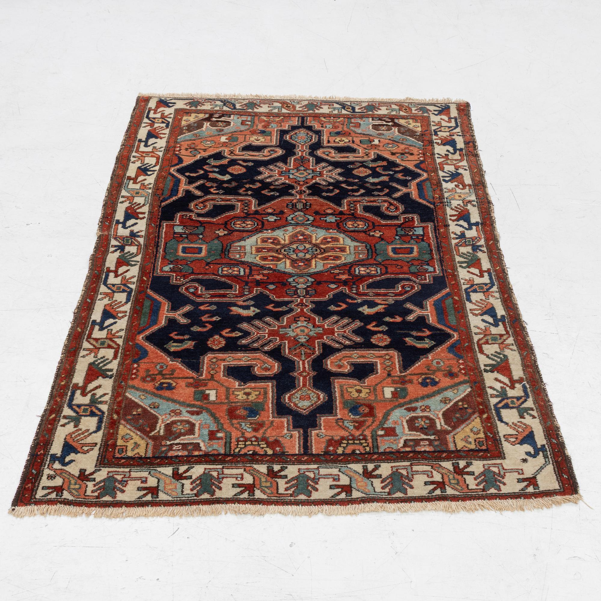 A Heriz rug, c. 192 x 133-139 cm.