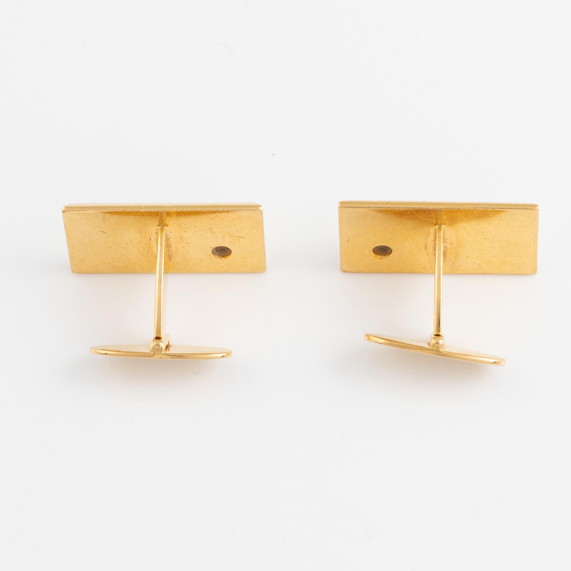 18K gold and brilliant cut diamond cufflinks.
