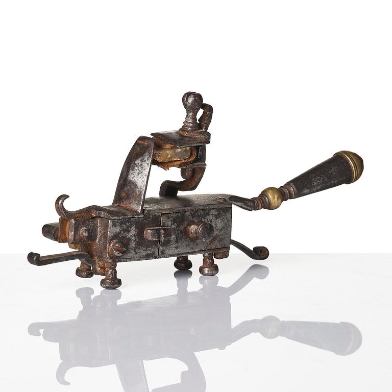 A mechanical flintlock igniter, later part 18th century/early19th century.