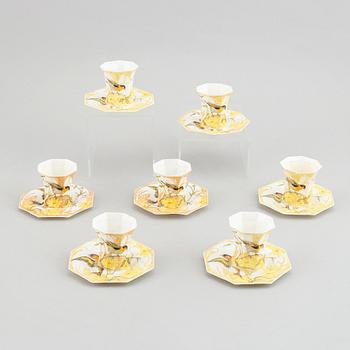 Rozenburg den Haag, seven egg shell porcelain cups and saucers, Holland, early 20th Cnntury.