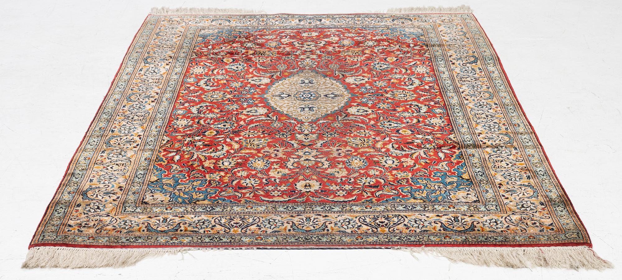 A silk Kashmir rug, c. 176 x 121 cm.
