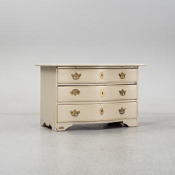 A late baroque chest of drawers.