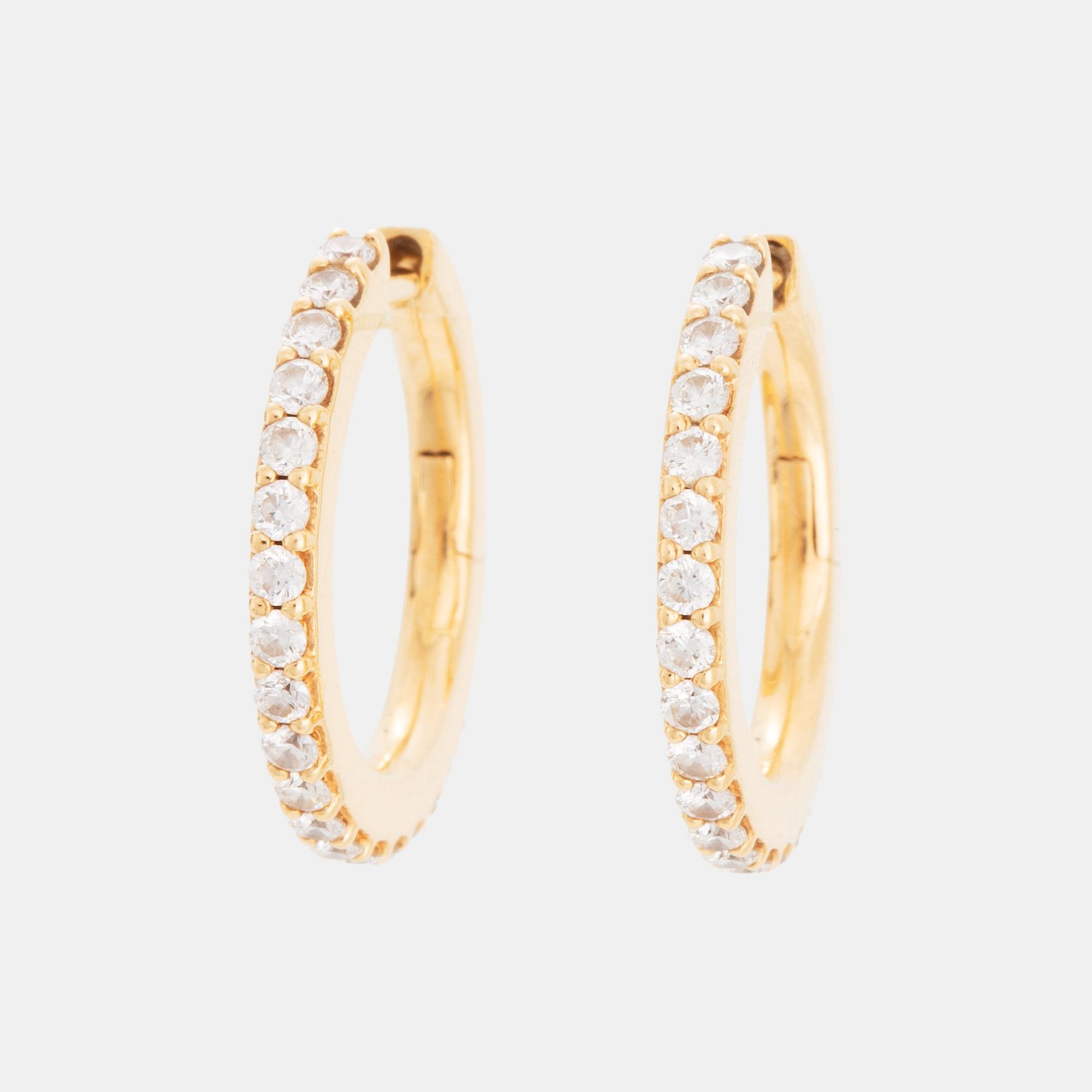 A pair of Ole Lynggaard earrings "Love" in 18K gold set with round brilliant-cut diamonds.
