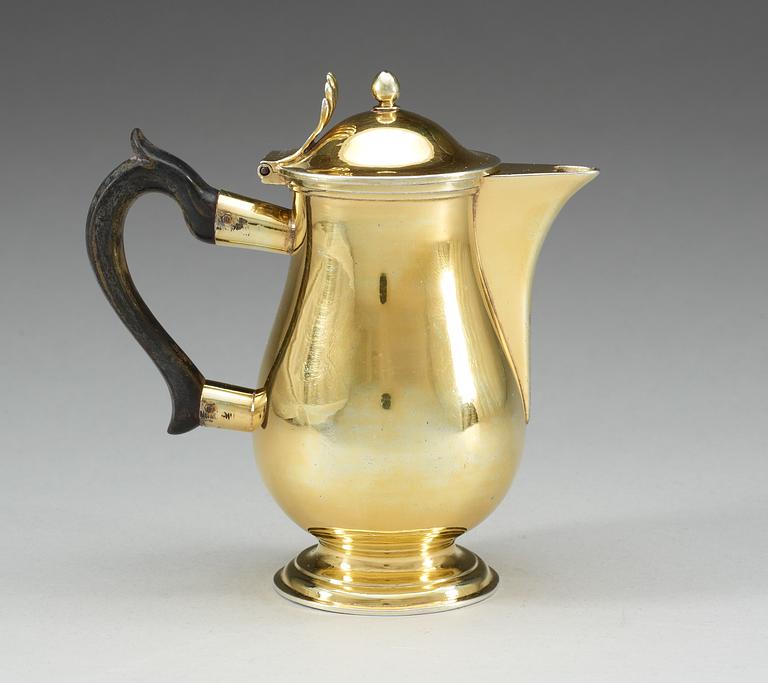 A Russian 19th century silver-gilt coffee-pot, makers mark of Alexander Jaschinkov, St. Petersburg 1805.