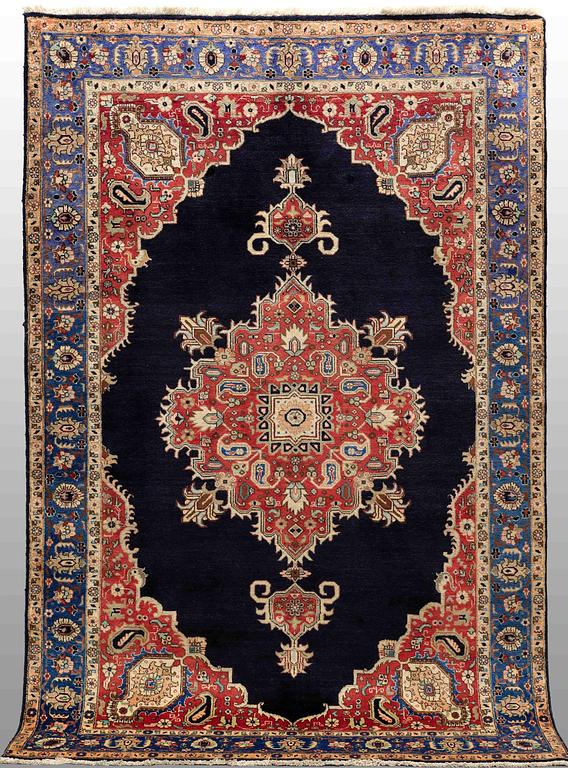 A carpet Tabriz around 265 x 170 cm.