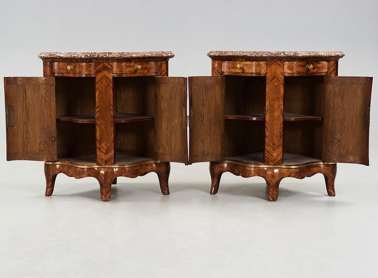 A pair of Louis XV 18th century corner cupboards.