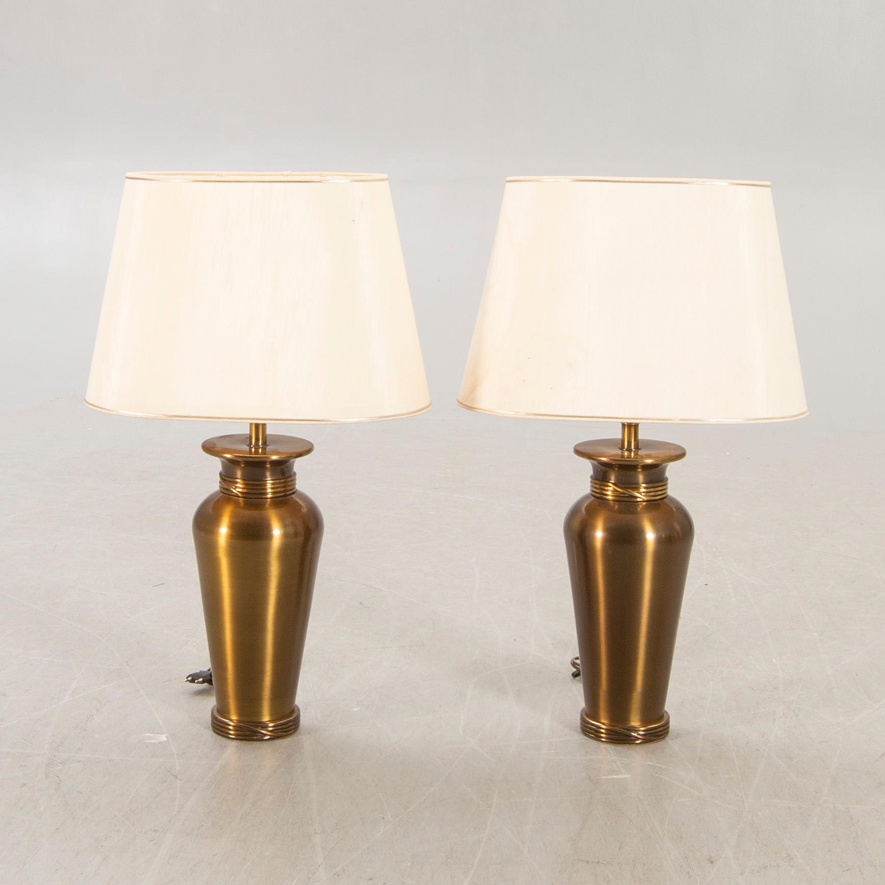 A pair of Deknut metall table lamps later part of the n20th century.