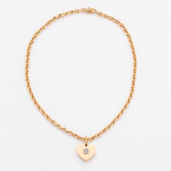 18K gold heart pendant with chain.