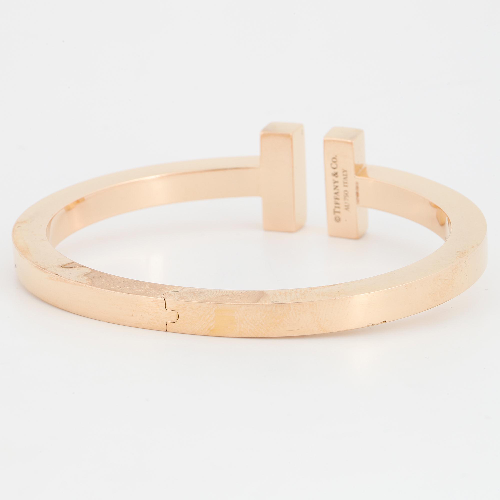 A Tiffany bracelet "T" in 18K rose gold set with round brilliant-cut diamonds.
