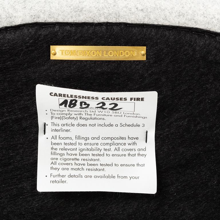 A 'Wingback Micro' easy chair by Tom Dixon.