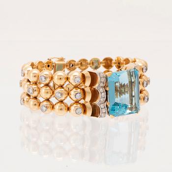 An 18K white and red gold bracelet set with rectangular step-cut aquamarine and round old-cut and brilliant-cut diamonds.