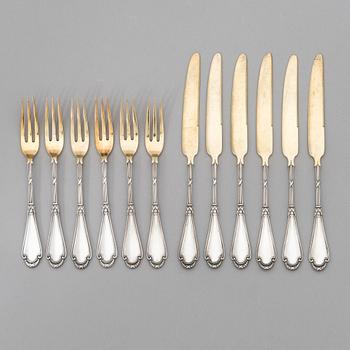 A set of Fabergé parcel-gilt silver dessert cutlery, 11 pieces + one fork later manufactured by Kultakeskus, Finland.