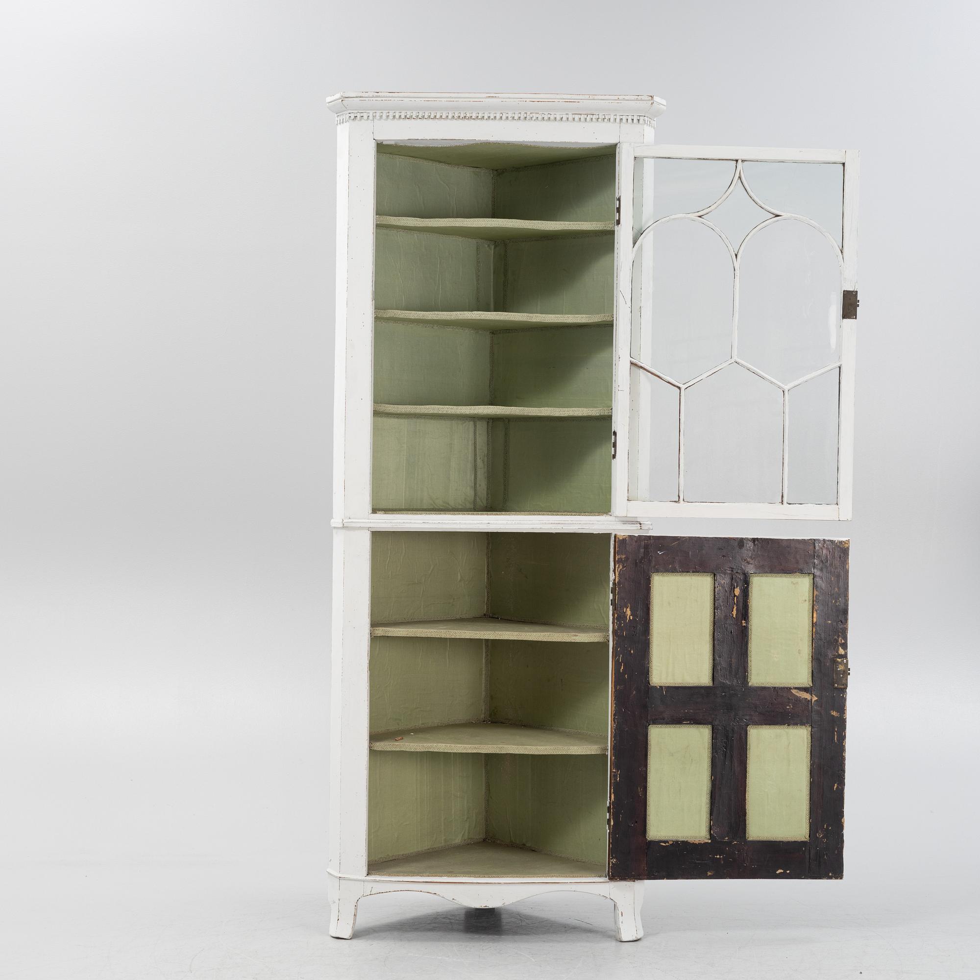 A gustavian style painted corner cabinet, 19th century.