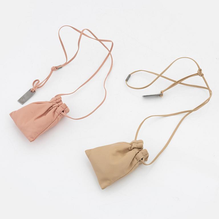 Gucci, a par of collarbags in pink and beige leather.