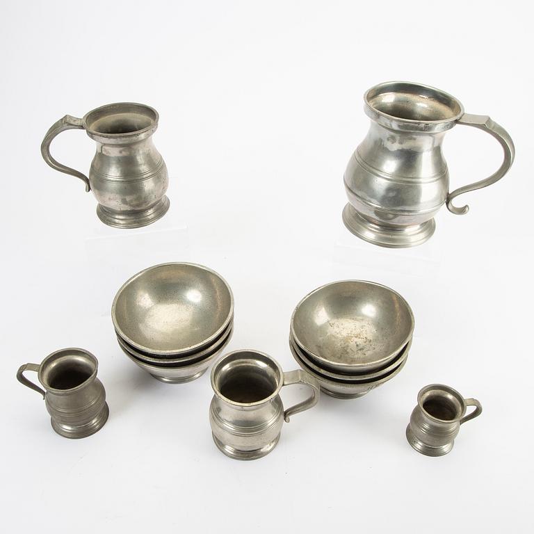 A set of five pewter tankards and six bowls England 20th century.