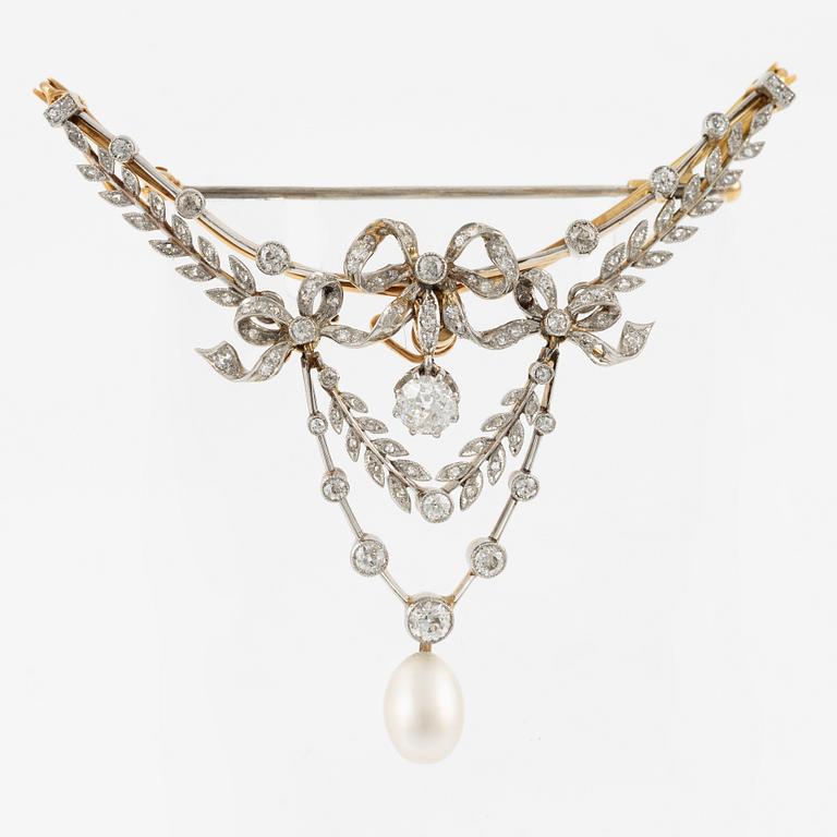 Brooch, gold and platinum, in the form of a bow and garlands with diamonds and a pearl.