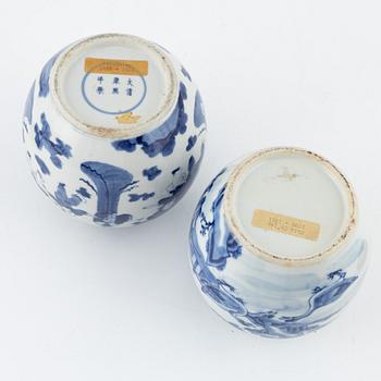 Two similar blue and white lidded urns, China, 19th century.